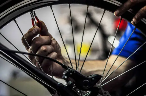 Close-up of a technician repairing a punctured inner tube